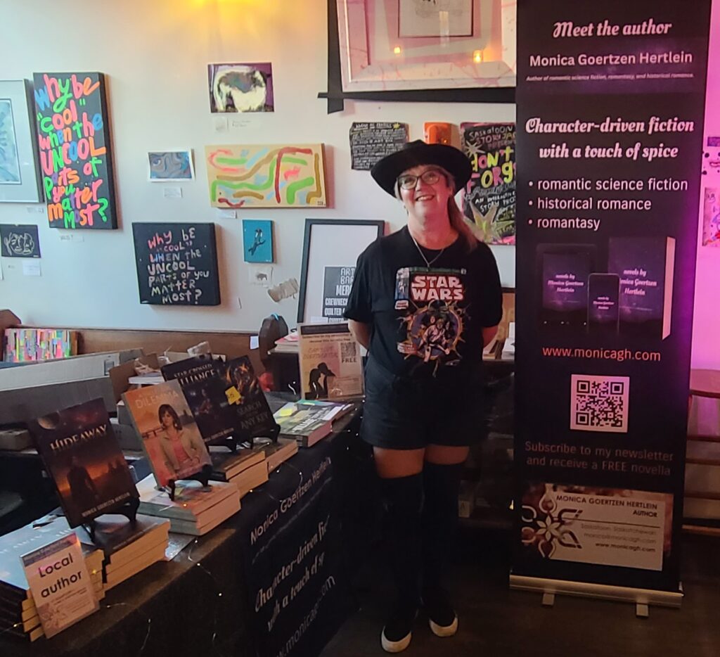 Monica with her book table at Art Bar